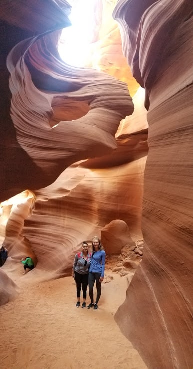 two women (us) standing under the Lady in the Wind in Antelope Canyon 