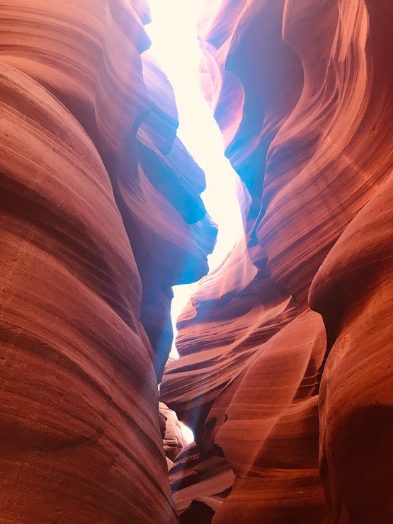 the walls of Lower Antelope Canyon as light streams throught