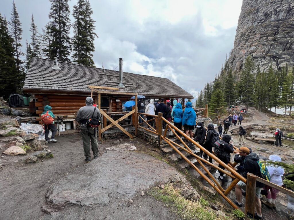 hikers line up at the Lake Agnes Tea House 
