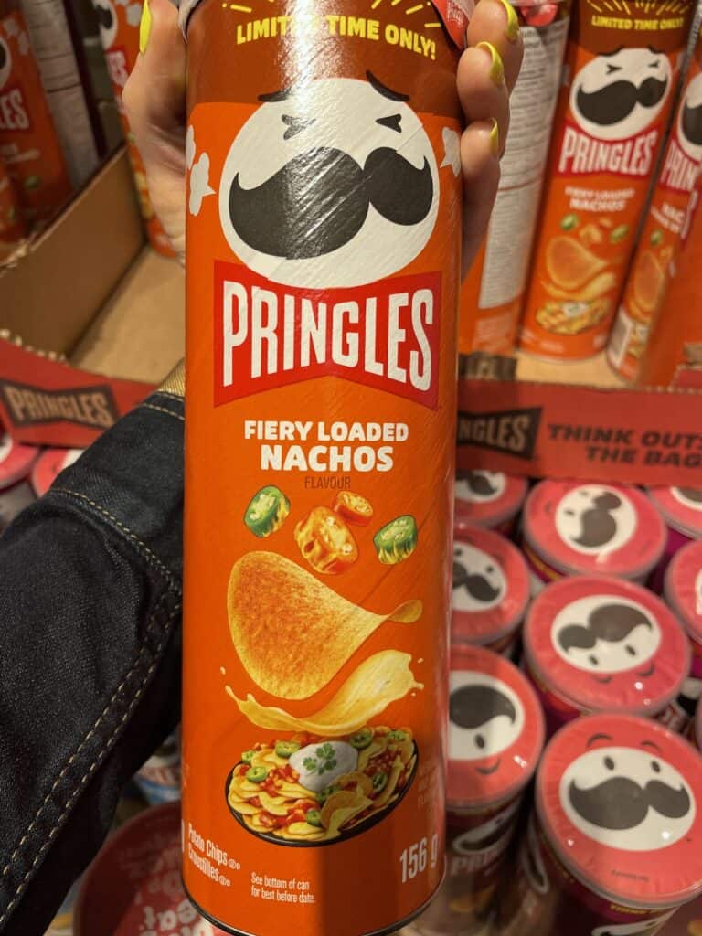 an orange can of Fiery Loaded Nacho Pringles 