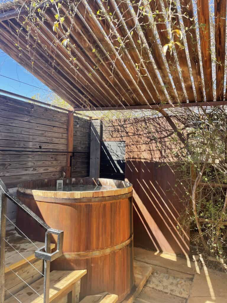 one of the beautiful outdoor wooden soaking tubs at the Remedy Day Spa