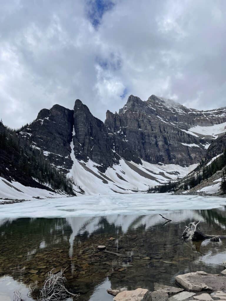 Lake Agnes on a cloudy day with snow on the lake