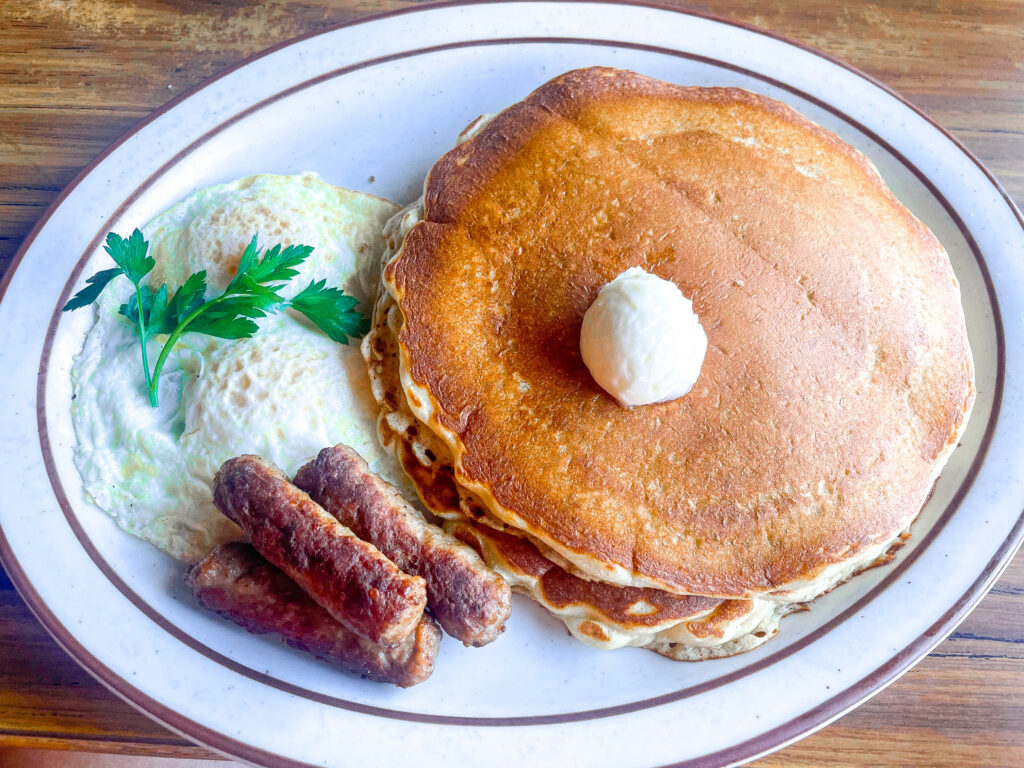 a plat4e of pancakes, sausage and two eggs over-easy from Bert's Cafe in South Lake Tahoe