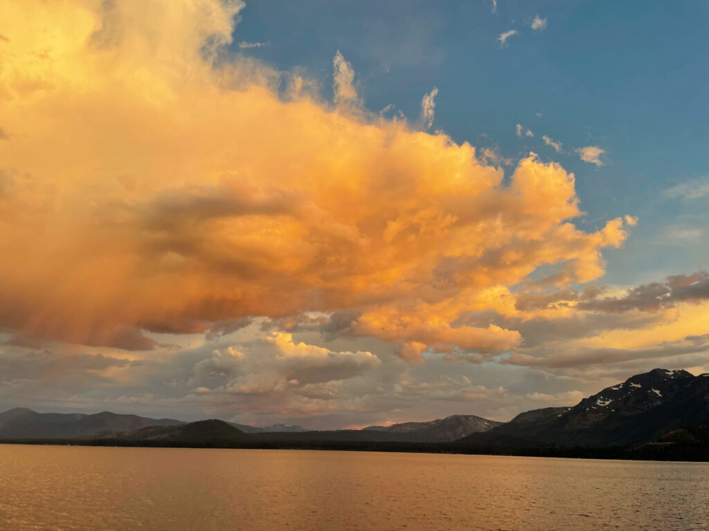 a beautiful orange cloud at sunset over Lake Tahoe